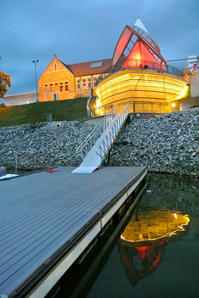An aluminum gangway going downwards to a dock