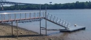 A gangway with a high tide bracket attached to it to keep it above any water level.